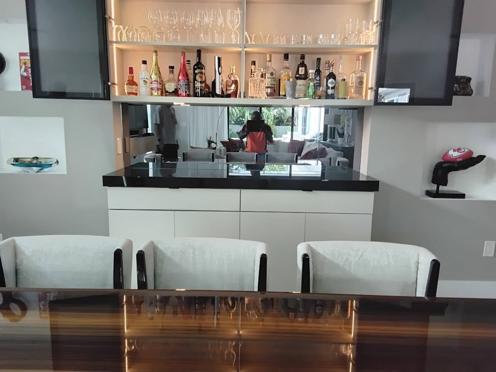 Mirrored bar wall installed by Sure Glass & Mirrors